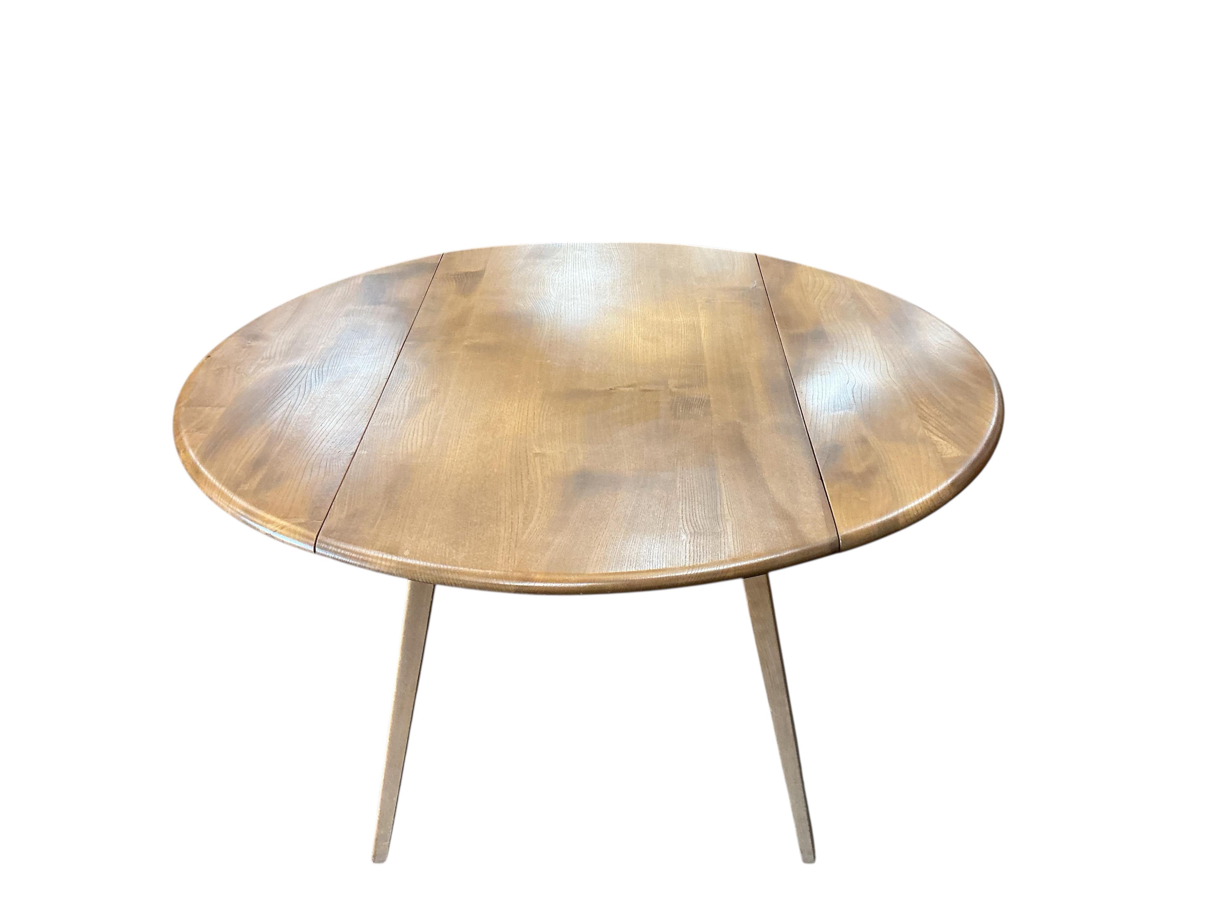 An Ercol light elm drop leaf dining table, width 112cm, depth 64cm, height 72cm